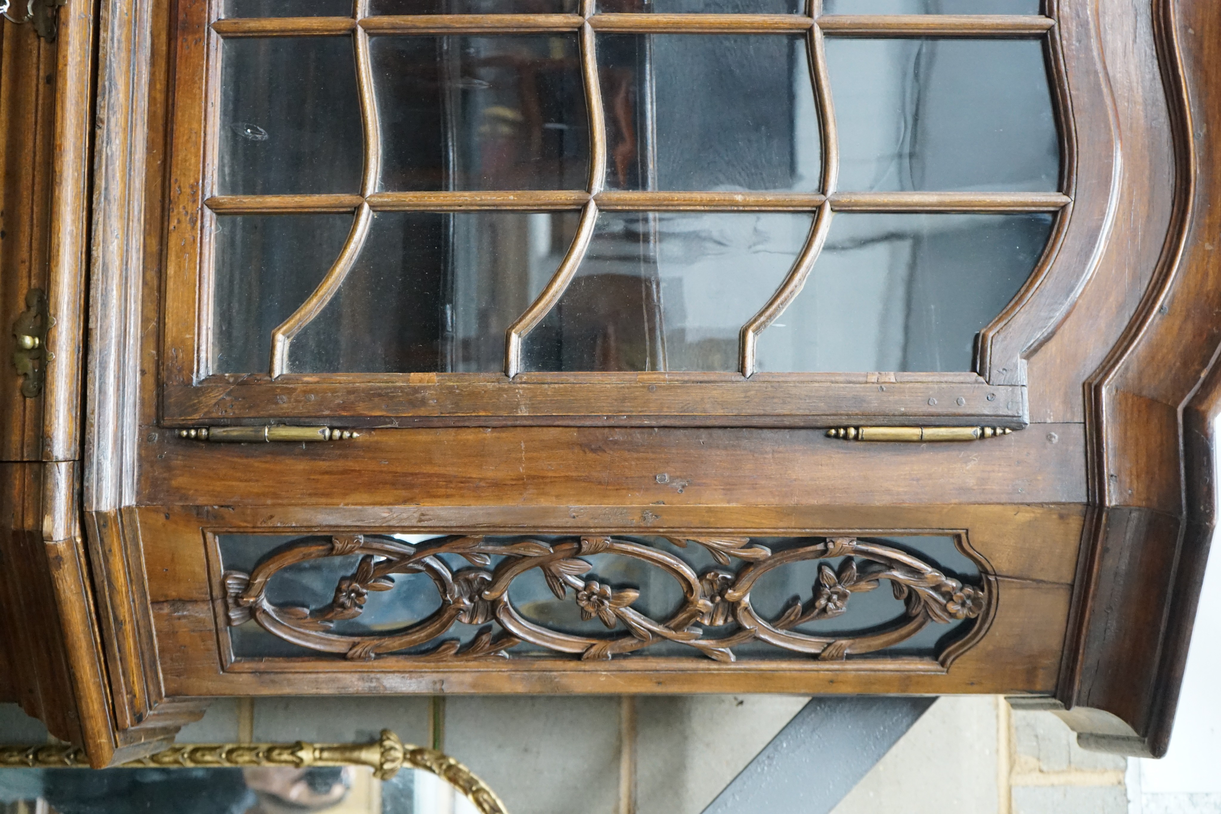 A 19th century Dutch oak and walnut glazed display cabinet, width 174cms, depth 47cms, height 227cms.